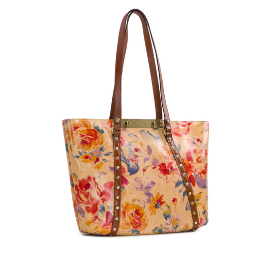 Patricia Nash Benvenuto Tote in Aegean Blooms with floral design and leather handles, showcasing elegant craftsmanship.