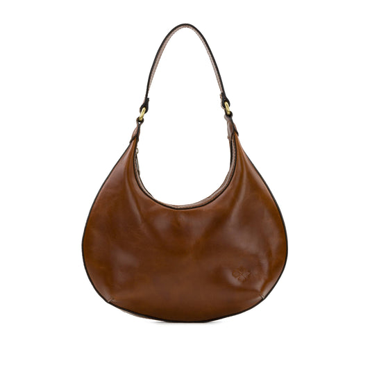 Patricia Nash Coco Crescent Hobo bag in cognac leather, featuring a slouchy design with textured finish and gold-tone hardware.