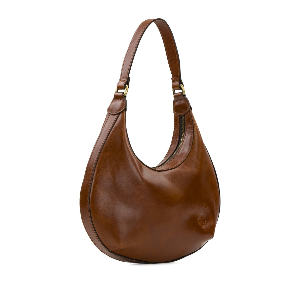 Patricia Nash Coco Crescent Hobo bag in cognac leather with a slouchy shape and adjustable shoulder strap.
