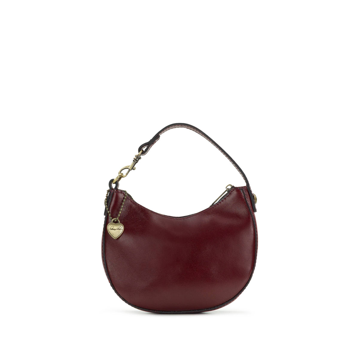 Patricia Nash Mini Morgana Bag Charm featuring leather detailing and intricate embellishments, attached to a handbag.
