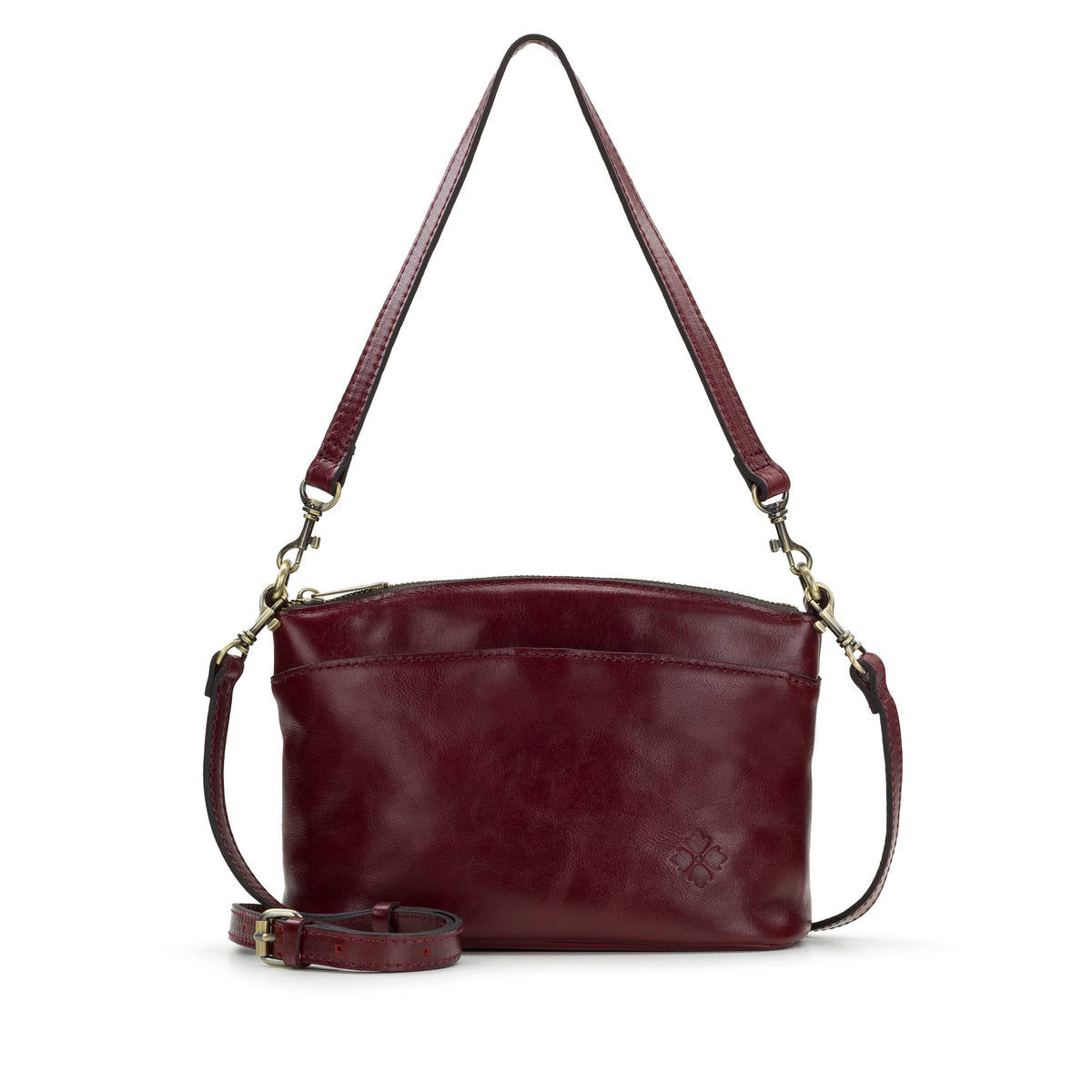 Patricia Nash Arlee Crossbody bag in brown leather with embossed floral details and adjustable strap.