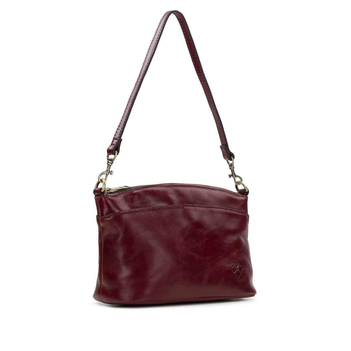 Patricia Nash Arlee Crossbody bag with textured leather exterior and adjustable strap, shown on a neutral background.