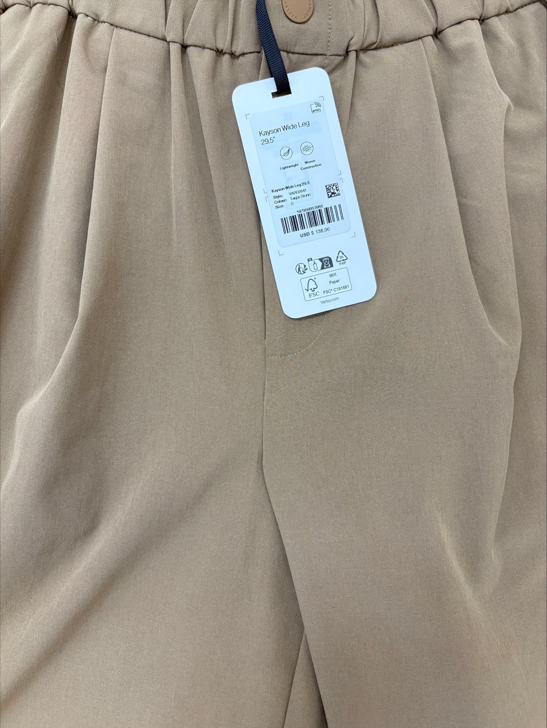 Taupe  pants with a tag 