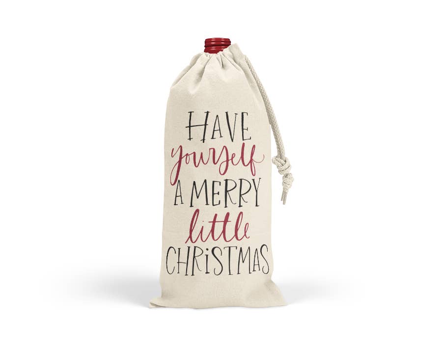 Canvas wine bag with a holiday Merry Little Christmas design and drawstring closure, perfect for festive gift gifting.