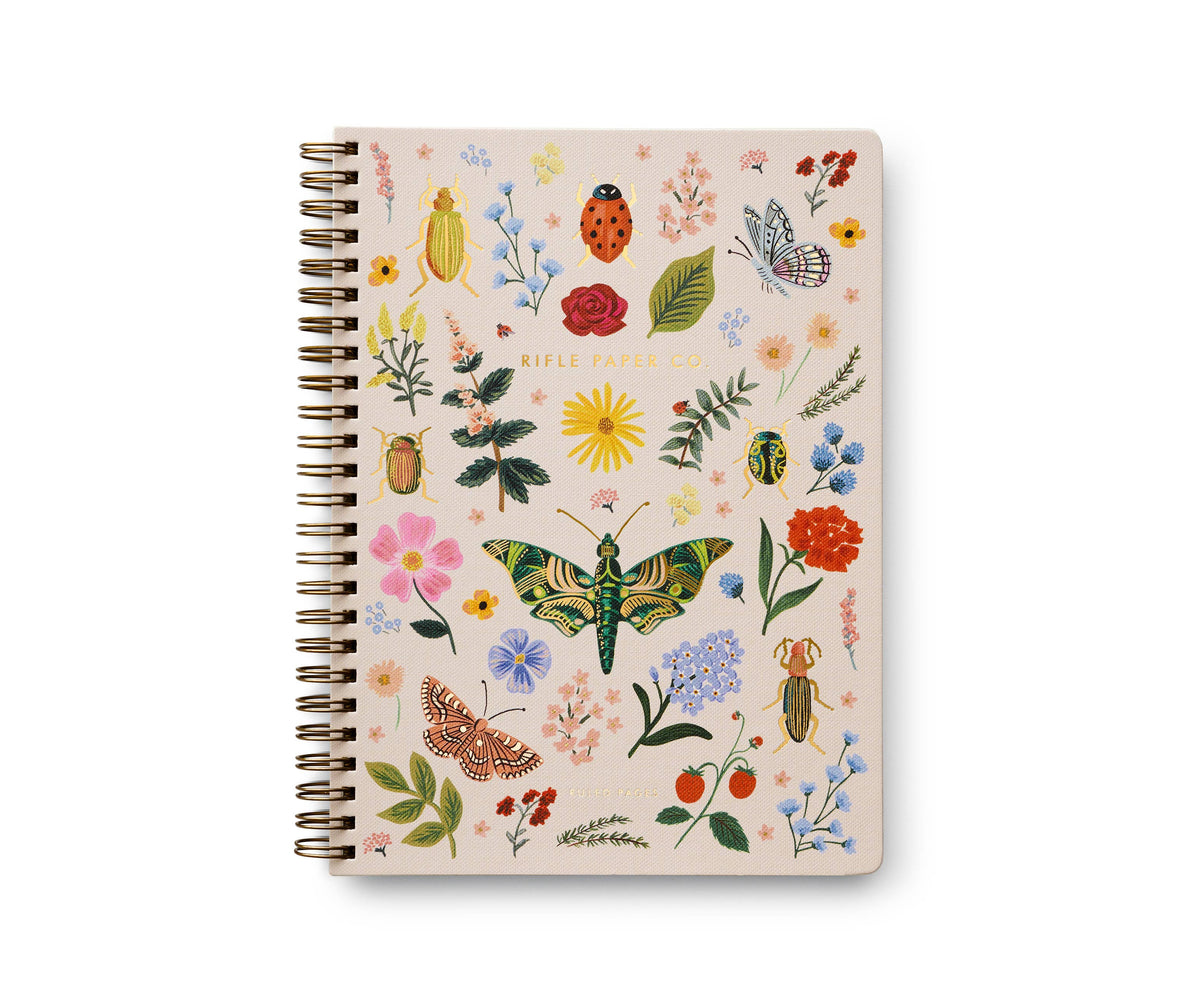 Rifle Paper Company Curio Spiral Notebook with floral cover and lined pages, ideal for writing and note-taking.