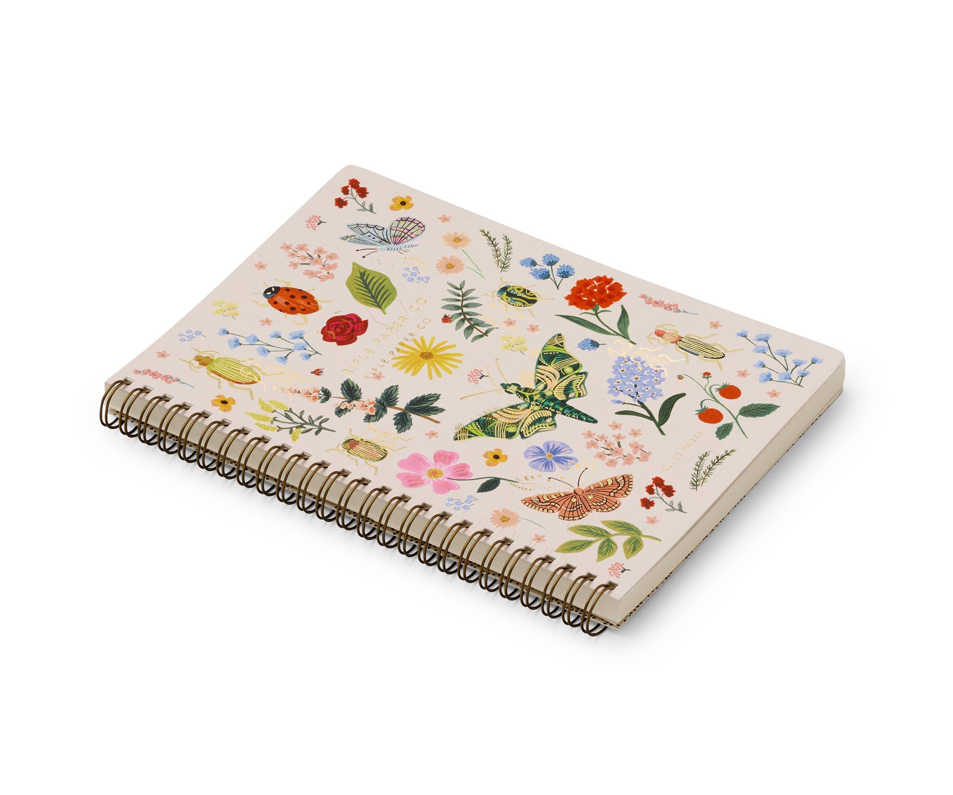 Rifle Paper Company Curio Spiral Notebook with floral cover and lined pages for writing and note-taking.