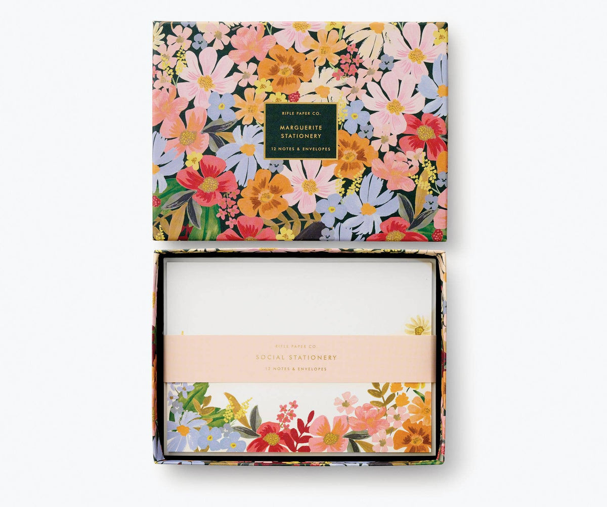 Rifle Paper Company Marguerite stationery set with floral-themed notecards and envelopes on a white background.