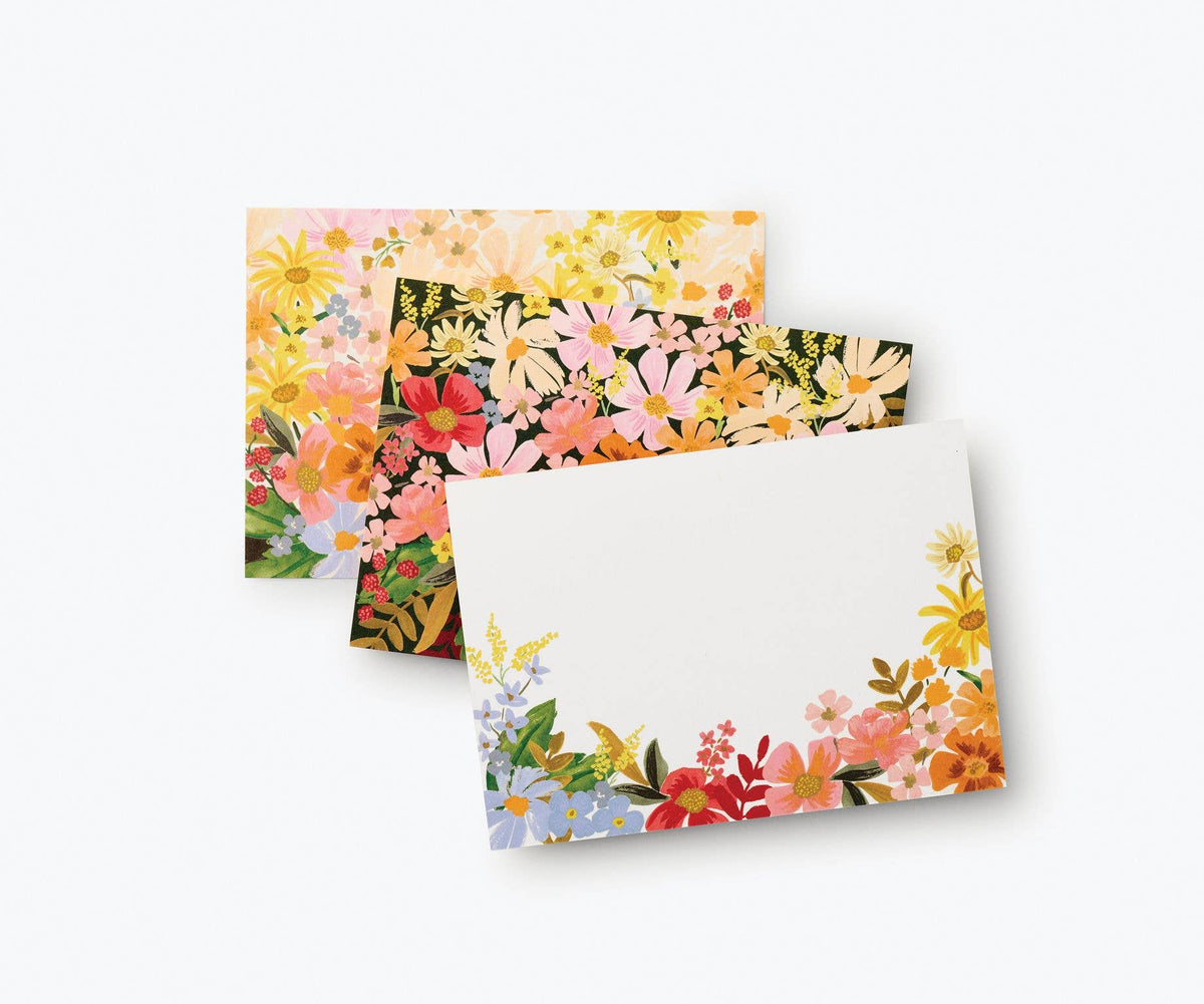 Rifle Paper Company Marguerite stationery set with floral patterned notebooks, notecards, and matching envelopes.