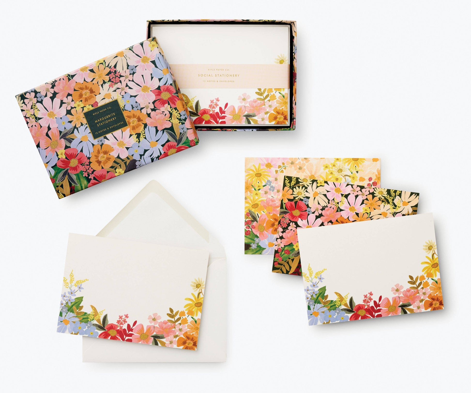 Rifle Paper Company Marguerite stationery set with floral patterned notecards and matching envelopes on a white background.