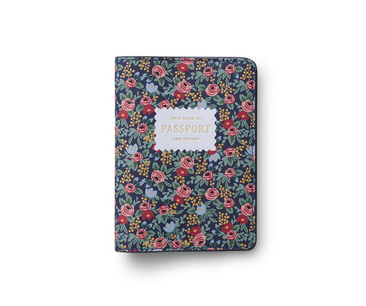 Rifle Paper Company Rosa passport holder with pink floral design and leather interior, ideal for travel accessories.