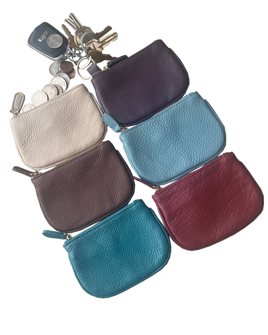 Roma Leathers cowhide leather coin purse with compact design and natural brown finish, showcasing durable craftsmanship.