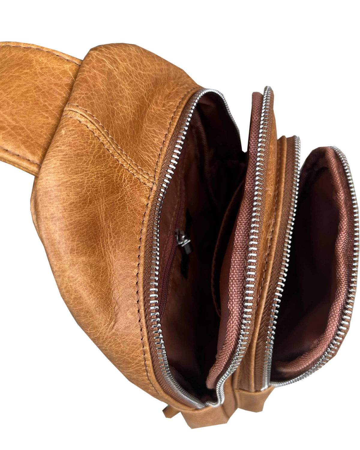 Cowhide leather sling bag with adjustable shoulder strap from Roma Leathers, Inc., featuring a sleek, compact design.
