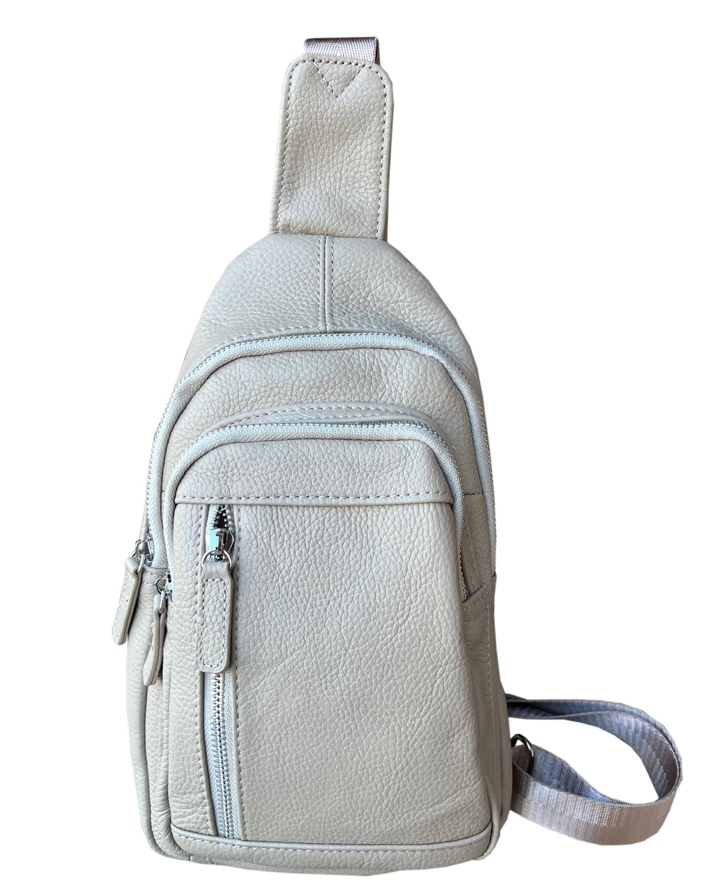 Roma Leathers cowhide leather sling bag with adjustable shoulder strap, showcasing a sleek, stylish design and natural leather texture.