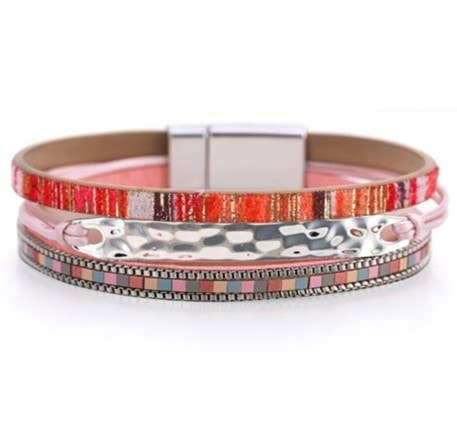 Pink leather strap and silver hammered bracelet by S & A Fashions, featuring a stylish, handcrafted jewelry design.