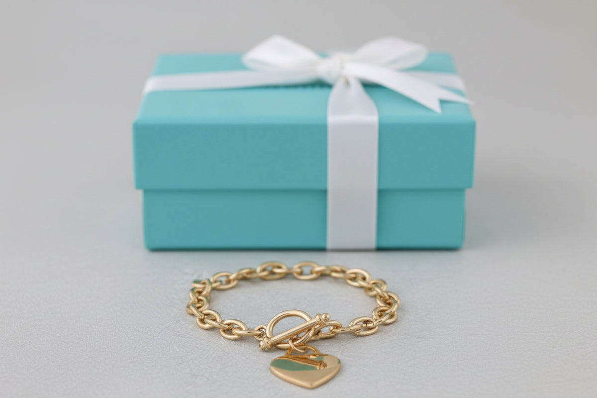 Gold 8-inch Tiffany Heart Tag Bracelet by S & A Fashions featuring a plated heart charm on a delicate chain.