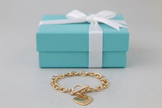 Gold 8-inch Tiffany Heart Tag Bracelet by S & A Fashions featuring a plated heart charm on a delicate chain.