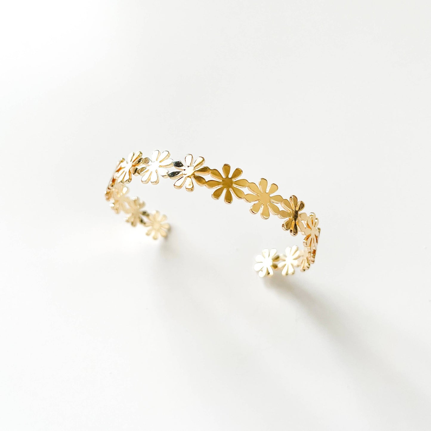 Fashion Daisy cuff bracelet by S & A Fashions featuring a floral design with daisy accents on a sleek metal band