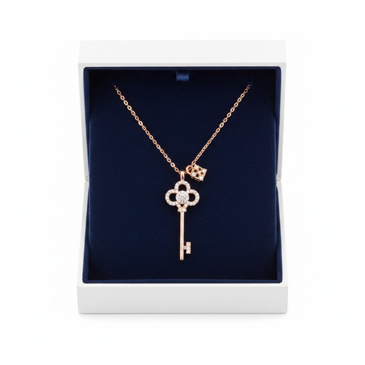 Rose gold crystal key and lock necklace from S&A Fashions featuring a delicate pendant with sparkling crystals.