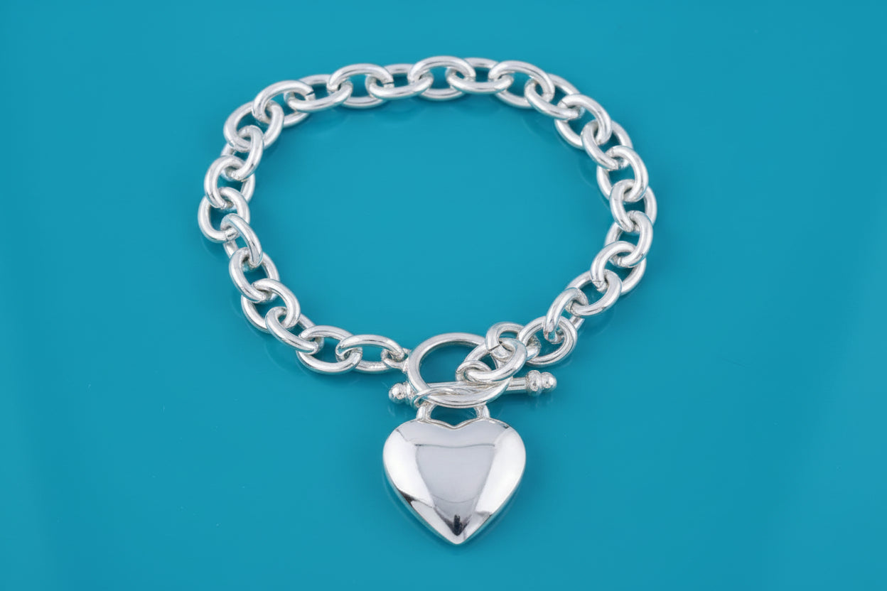 Silver 8-inch Tiffany heart tag bracelet by S & A Fashions with plated finish, featuring a delicate heart-shaped charm.