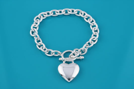Silver 8-inch Tiffany heart tag bracelet by S & A Fashions with plated finish, featuring a delicate heart-shaped charm.