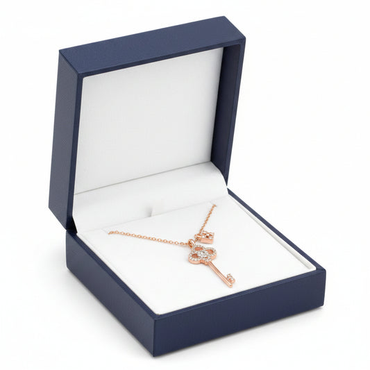 Silver crystal key and lock necklace by S&A Fashions featuring a detailed pendant with sparkling crystal accents.