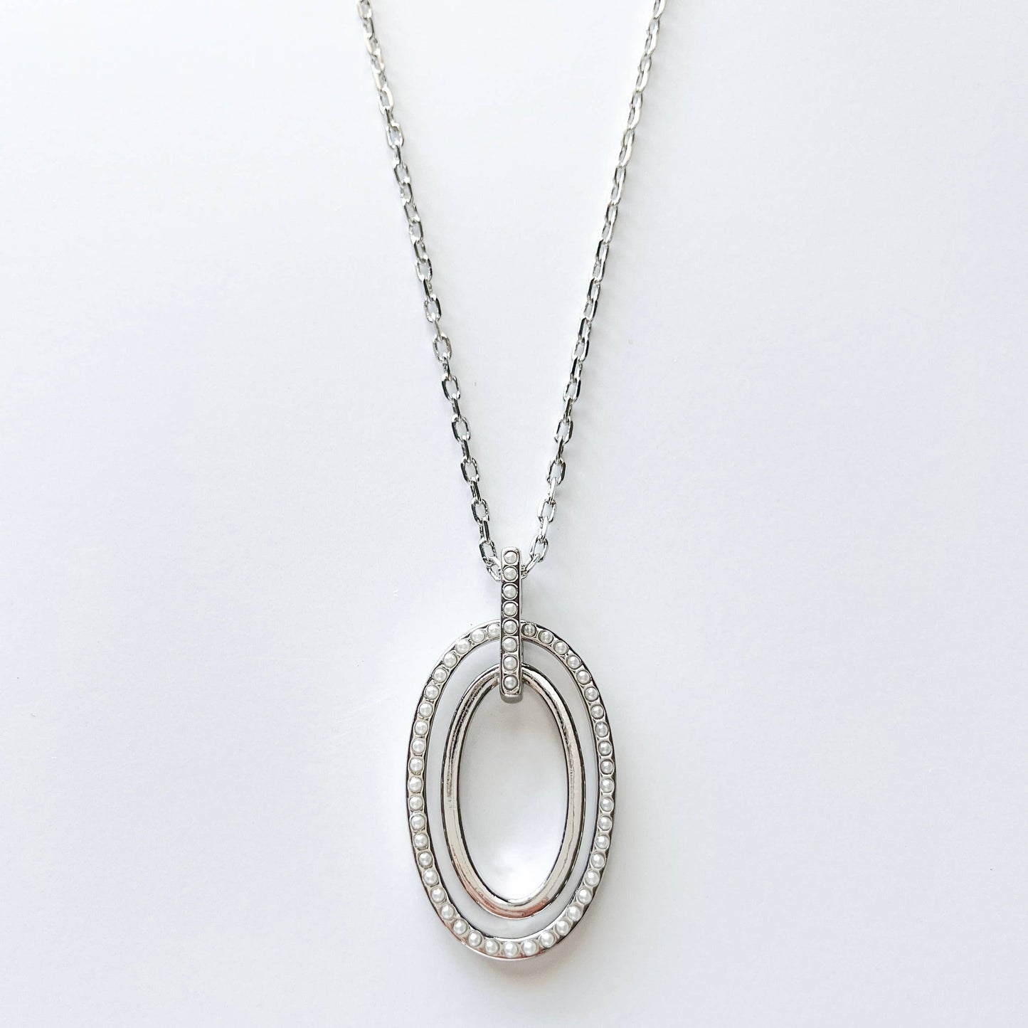 S & A Fashions double oval pendant necklace with mini faux pearls, featuring a stylish and elegant jewelry design.
