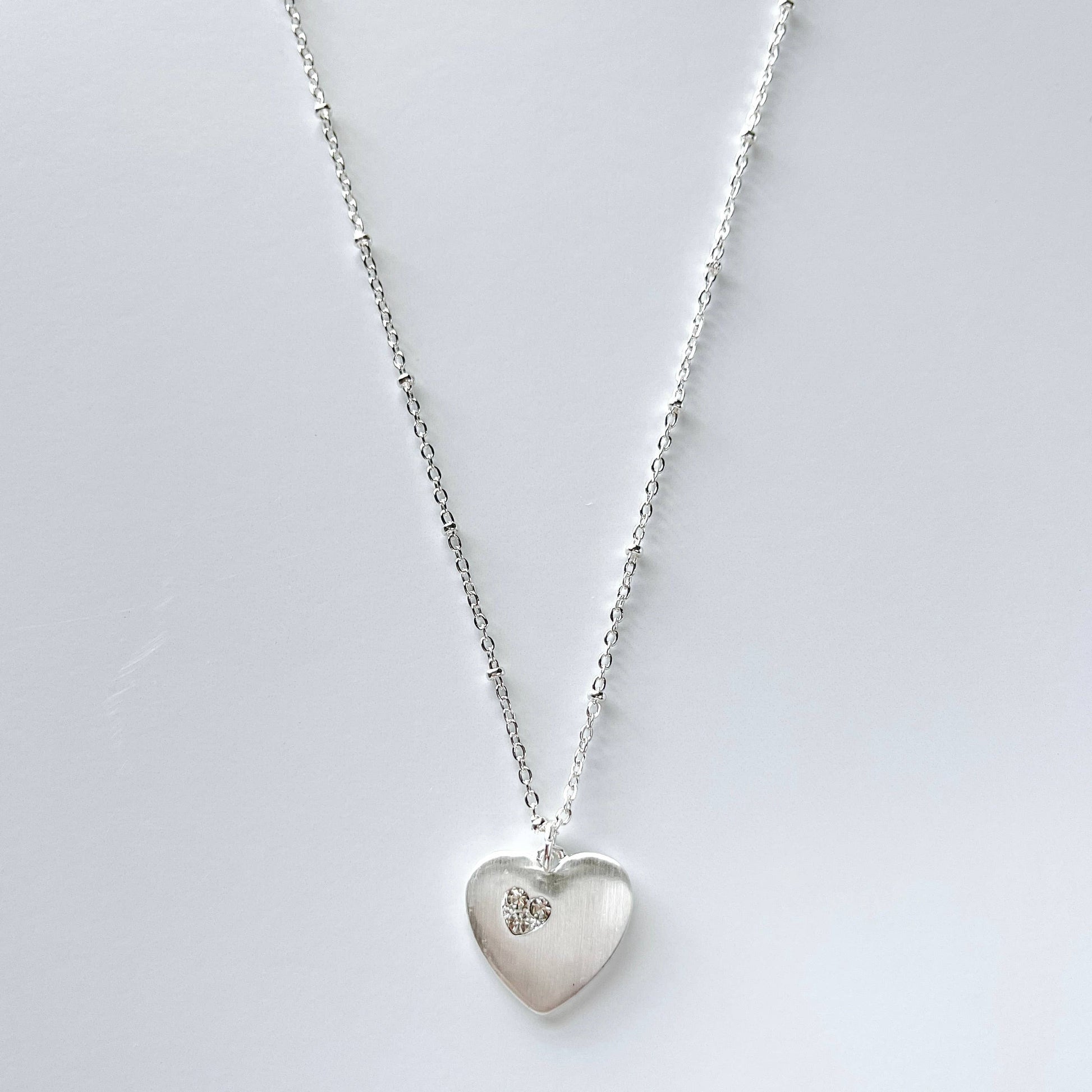S & A Fashions heart-shaped stone pendant necklace with a delicate chain, perfect for stylish jewelry accessories.