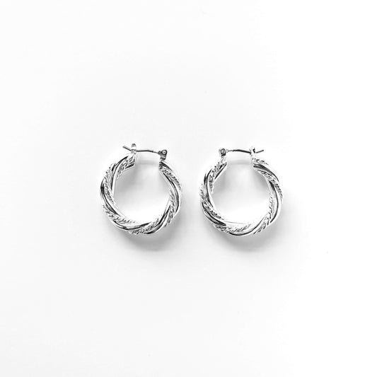 S&A Fashions twisted solid and rope hoop earrings showcasing a stylish, circular design with textured detailing.