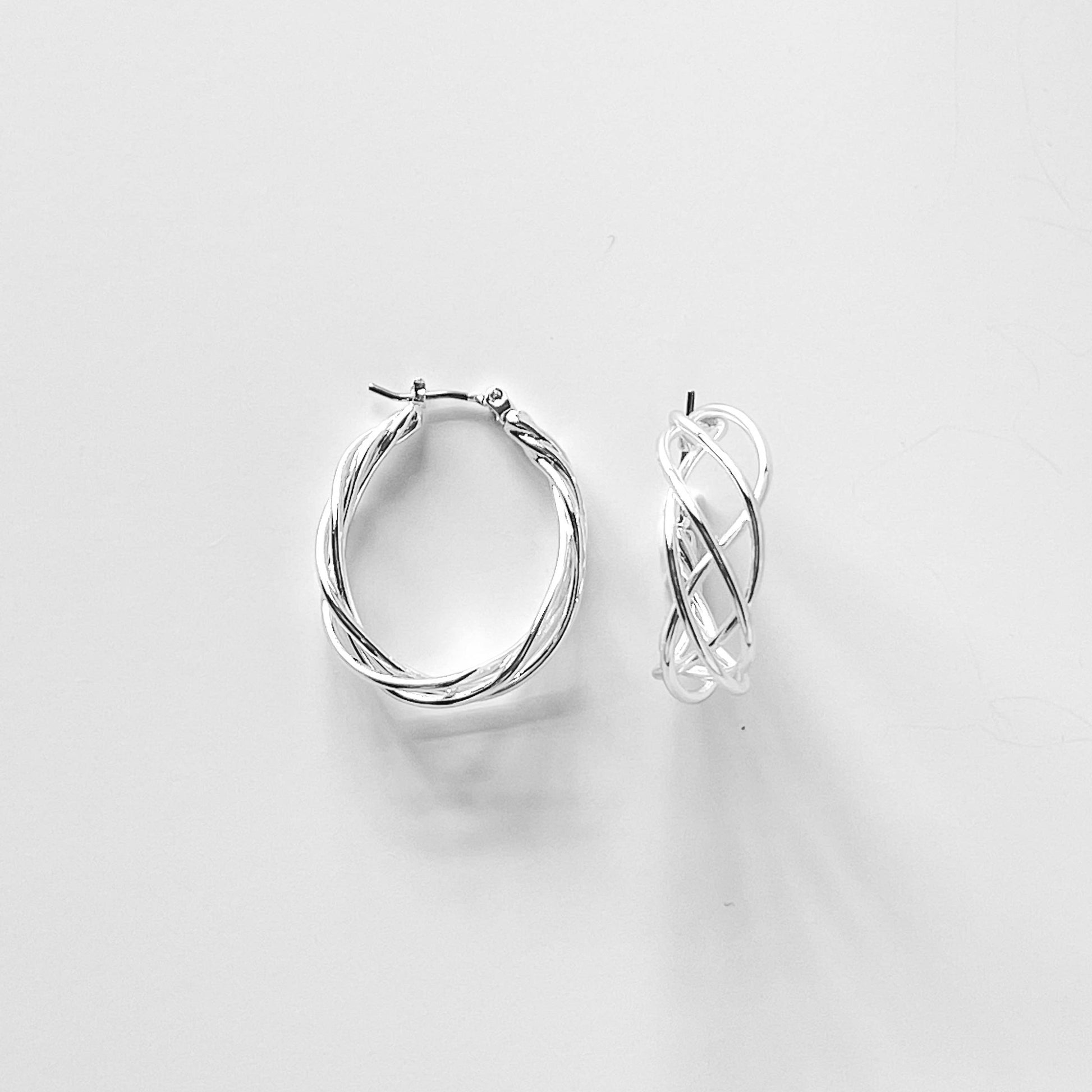 Fashion Wire Braided Teardrop Hoop Earrings by S & A Fashions featuring intricate braided metal design and teardrop shape.