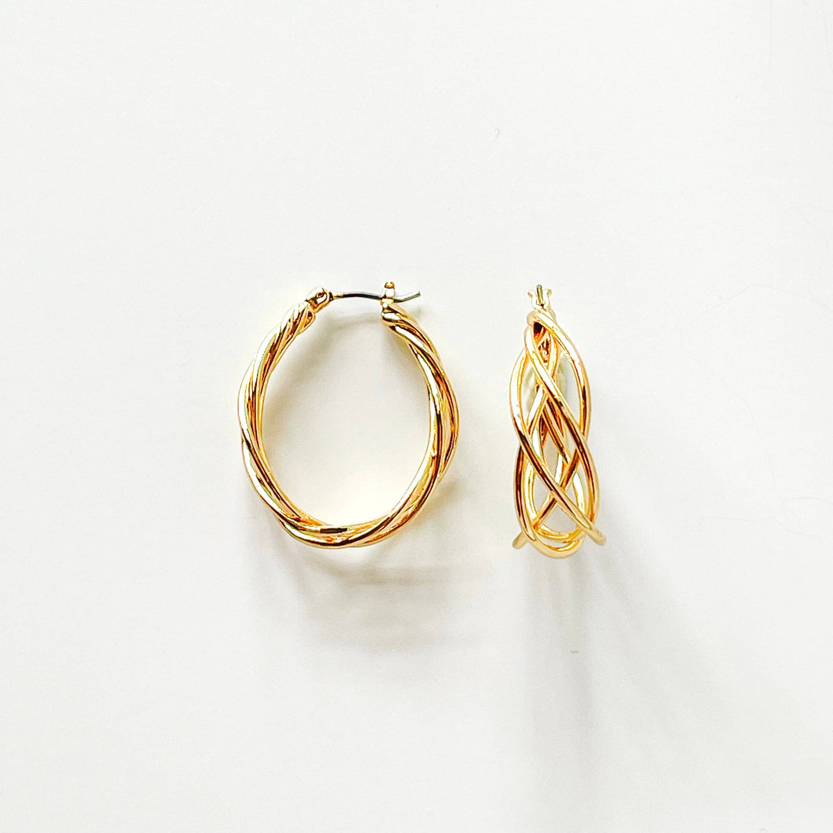S & A Fashions braided wire teardrop hoop earrings with intricate woven design and lightweight metal construction.