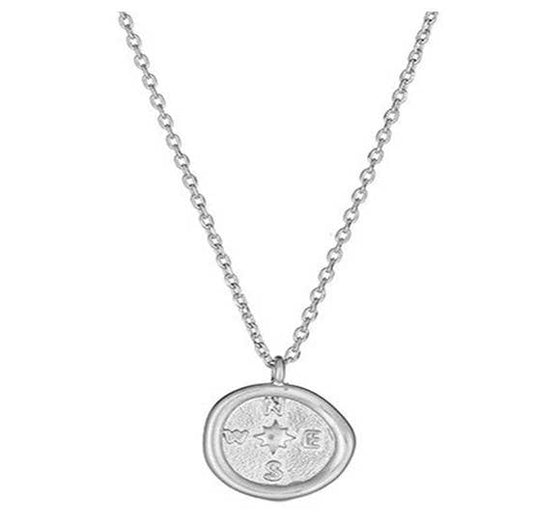 White gold compass coin necklace by S & A Fashions featuring a detailed engraved design on a sleek chain.