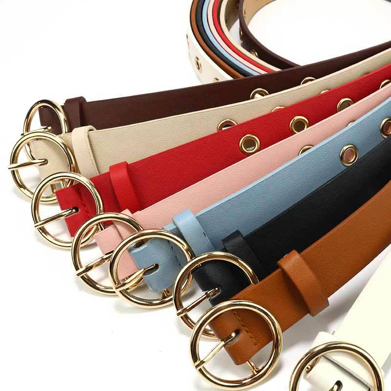 Leather belt with round buckle by SALINA TRADING INC, featuring a stylish metal round buckle and classic design.