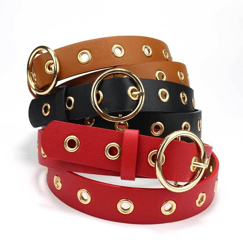 Leather belt with round buckle by SALINA TRADING INC, featuring a sleek design and adjustable strap for everyday wear.