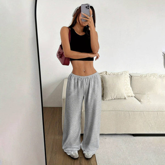 Loose wide-leg pants by SALINA TRADING INC featuring flowy fabric and relaxed fit, shown in a natural standing pose.