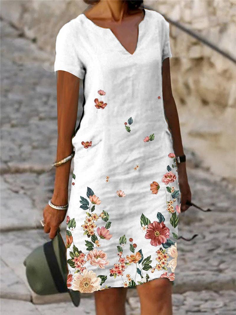 Floral printed short-sleeve V-neck dress from SALINA TRADING INC with vibrant flower patterns on lightweight fabric