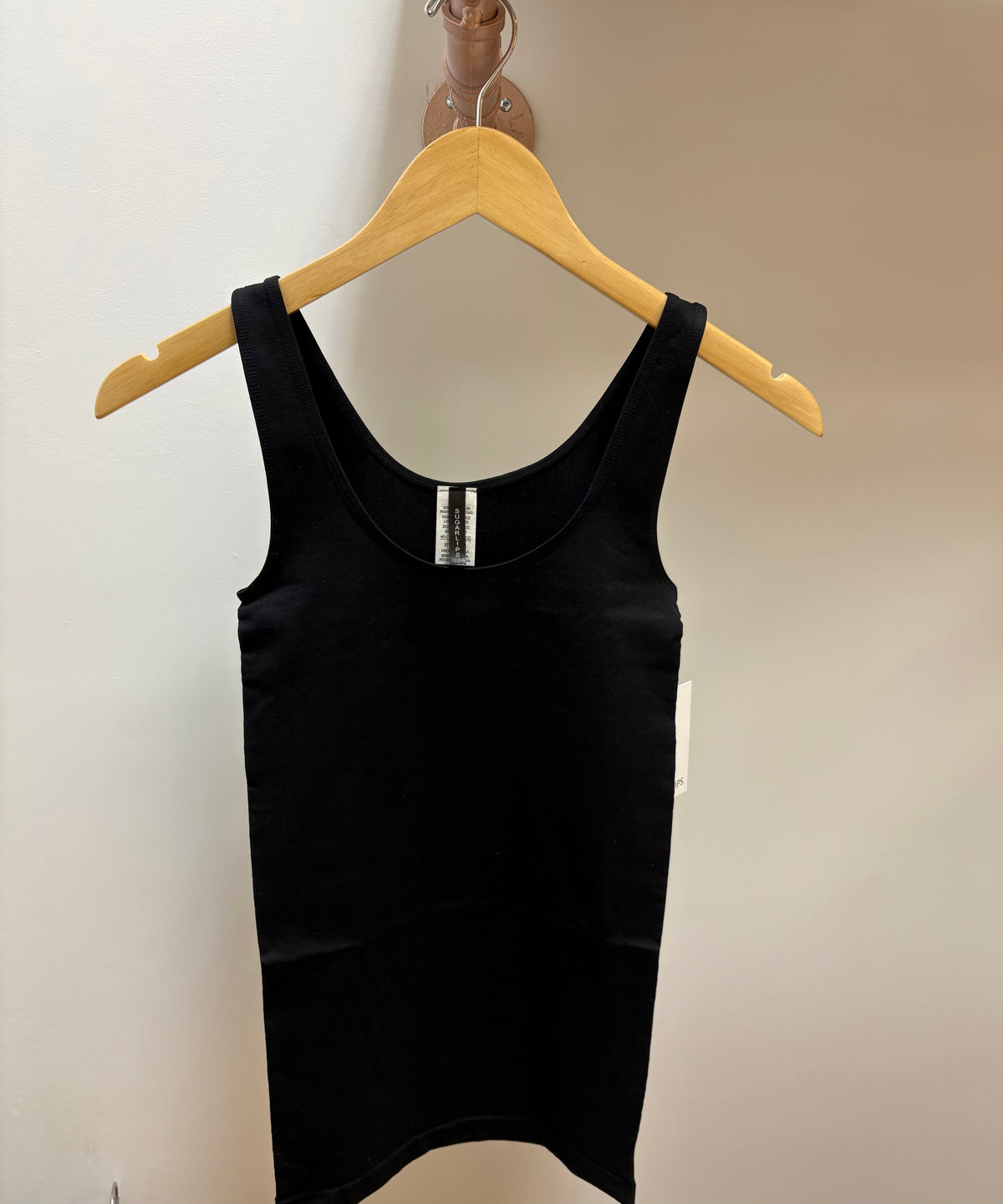 Black seamless tank top from Sugarl!ps featuring a fitted, smooth design perfect for active or casual wear.