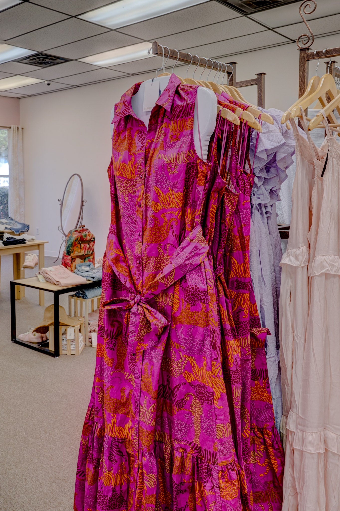 Sugarl!ps In the Jungle Cileah Magenta Collared Maxi Dress displayed on a hanger with a vibrant jungle print.