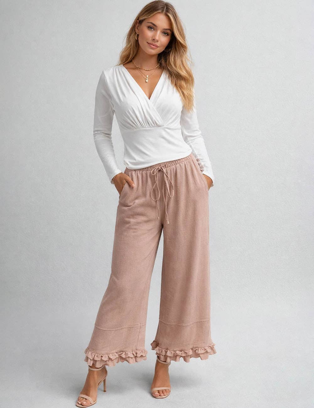 Sweetkama ladies wide-leg pants with elastic waist, drawstring, and ruffle hem, showcasing relaxed fit and stylish design.