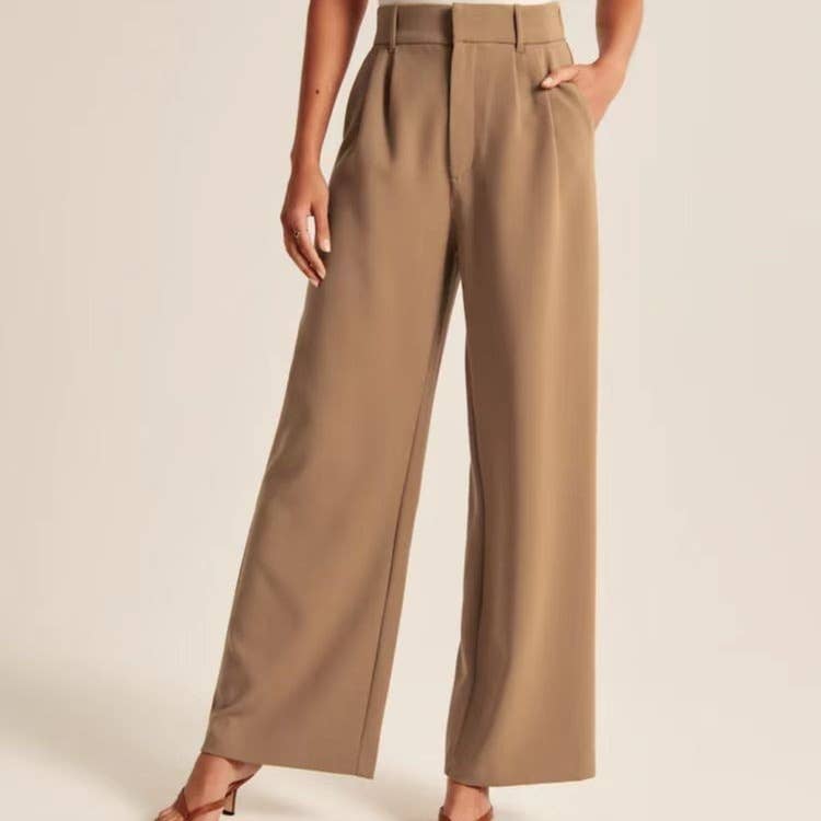 Sweetkama ladies solid color high waist straight leg pants displayed on a hanger, showcasing the sleek fit and fabric texture.