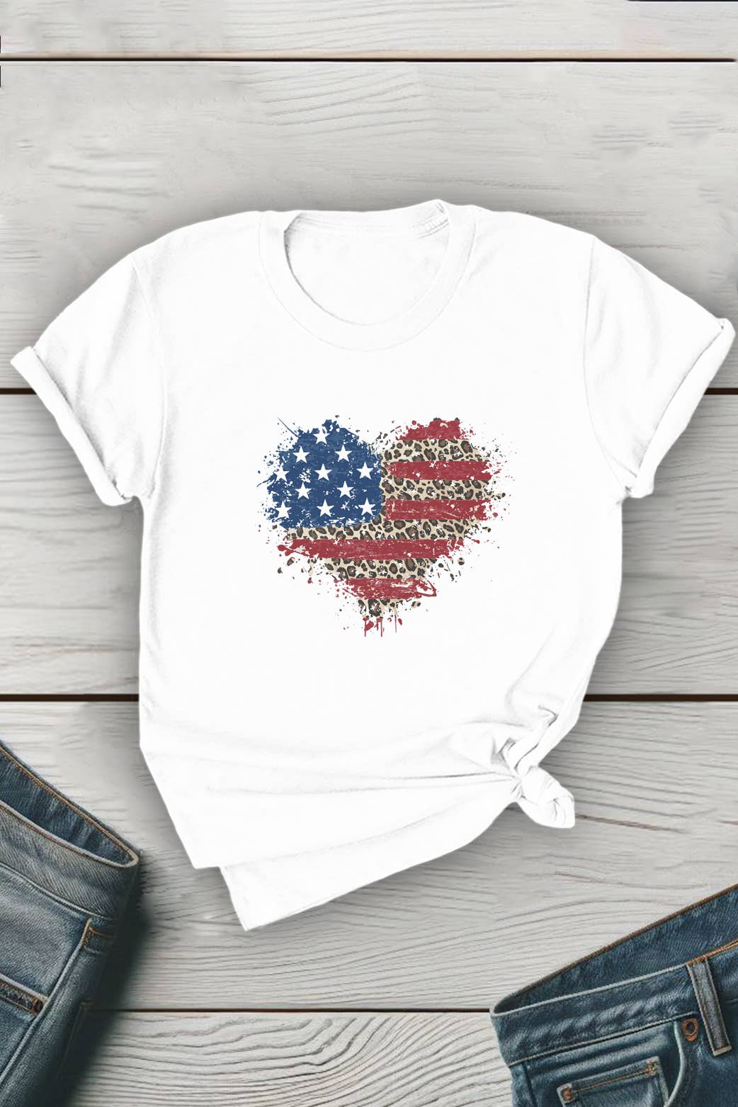 Unisex round neck T-shirt with American flag heart splatter design by Top Avenue, featuring patriotic red, white, and blue colors.