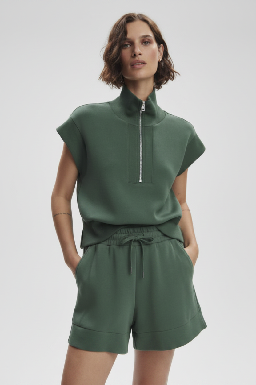 Varley Atrium High Rise Short 4.5 in black, showing close-up of the stretch fabric and high-rise waist design.