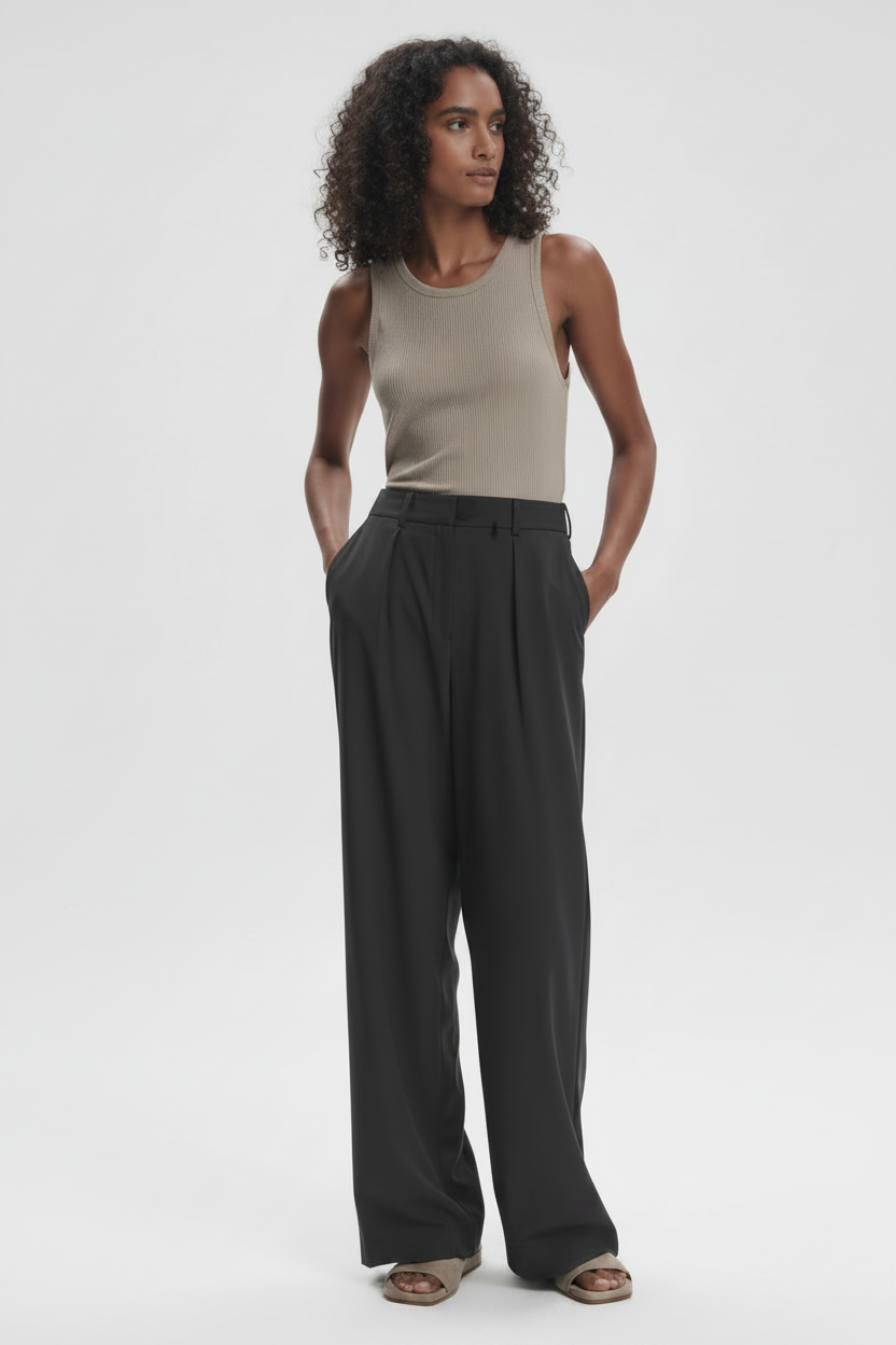 Varley Kayson wide leg trousers shown in neutral fabric with a high waist and relaxed fit, styled with a casual top.