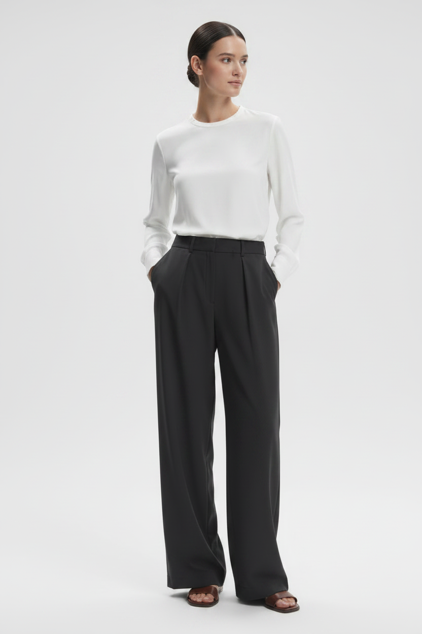 Varley Kayson wide leg trousers shown in neutral fabric with a relaxed fit and high waist, styled with a tucked-in top.