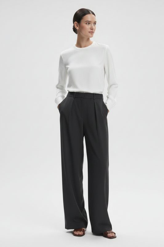 Varley Kayson wide leg trousers shown in neutral fabric with a relaxed fit and high waist, styled with a tucked-in top.