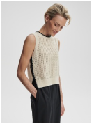 Varley Delaney knit vest in cozy, textured fabric, featuring a sleeveless design and a classic V-neck, perfect for layered styling.