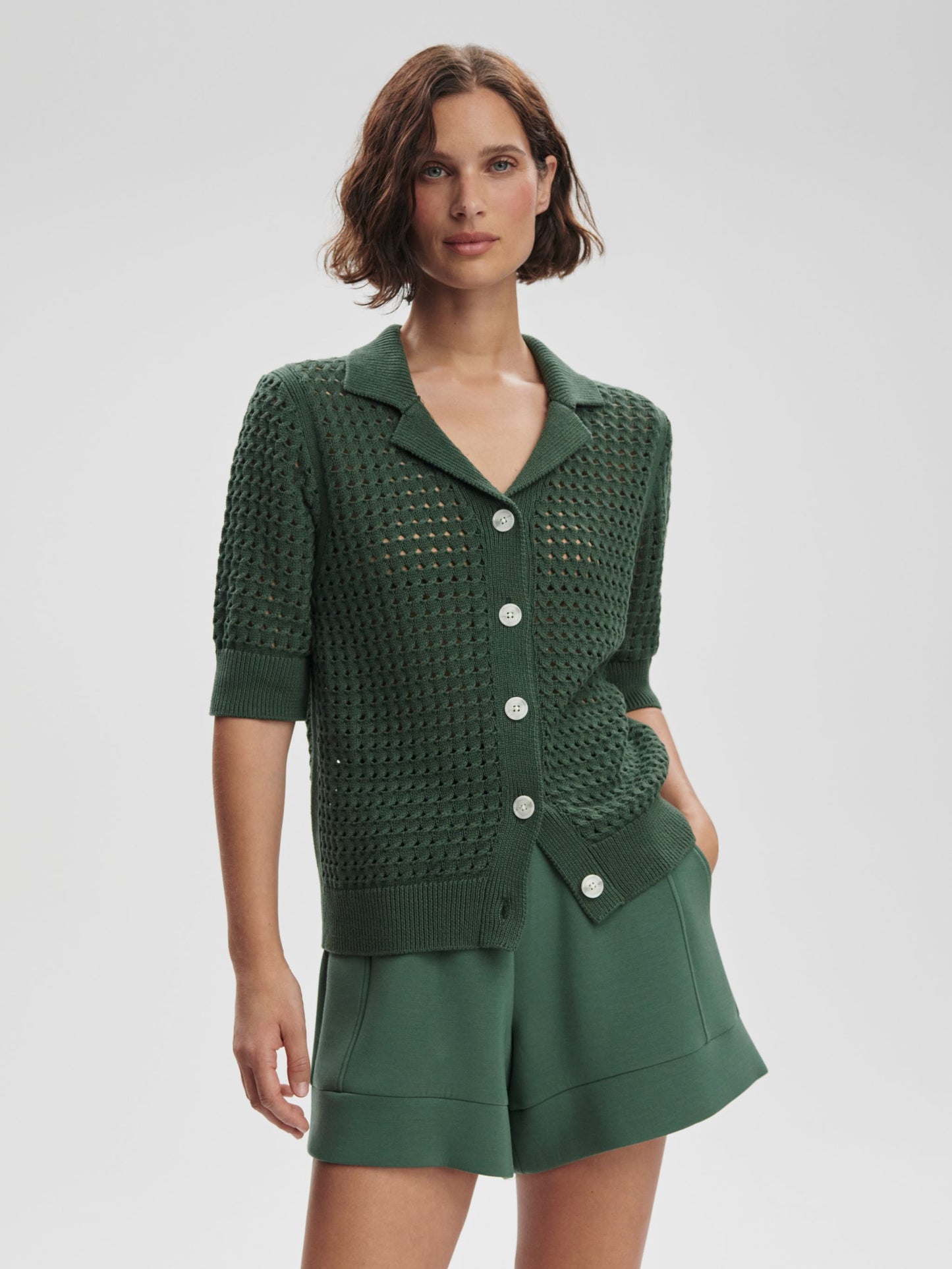 Ellie knit shirt by Varley featuring a cozy, textured design in a soft, neutral color, displayed on a mannequin.