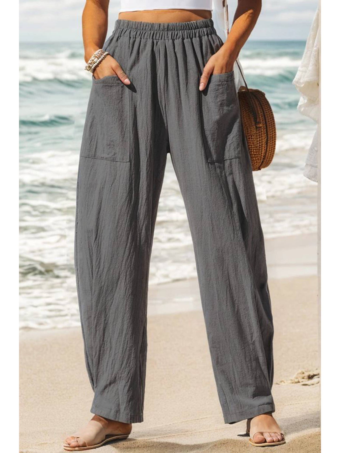 Gray solid casual cargo pants from Wholesalesir with relaxed fit and multiple pockets, displayed on a neutral background.