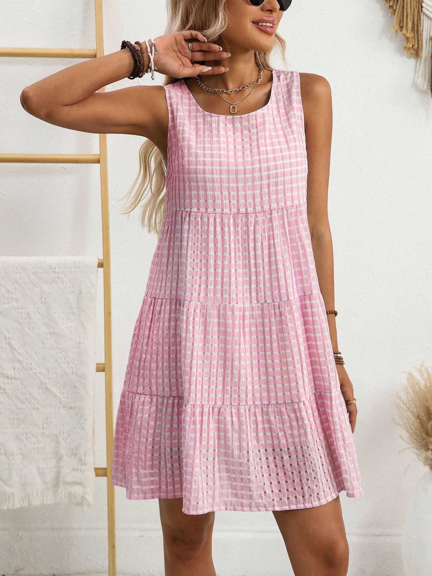 Sleeveless plaid dress by Wholesalesir featuring a stylish checkered pattern and a flattering fit, perfect for casual or summer wear.